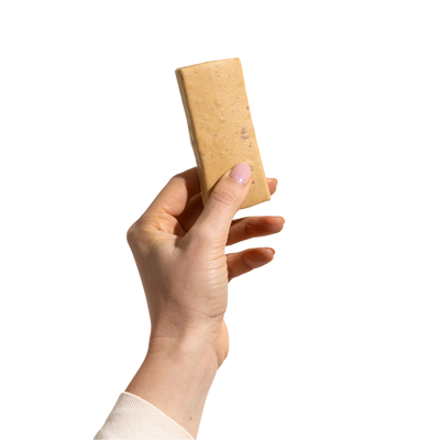 A hand holding a Strawberry Shortcake  Bar by Good Betty. 